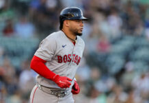 Red Sox must keep July’s hot streak alive against Dodgers tonight Baseball player in a Boston uniform running on the field with a helmet and red sleeves.